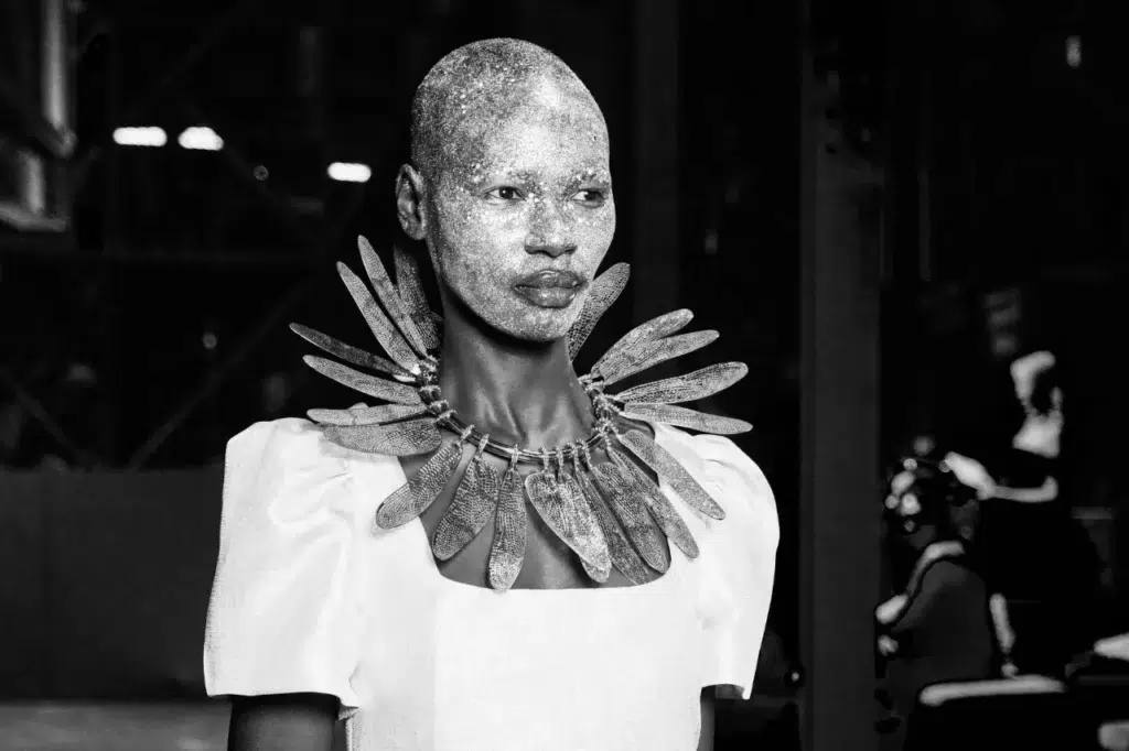 Black and white portrait of a runway model wearing a fine jewellery necklace, Mineshift event at Zeitz MOCAA. Captured by event photographer