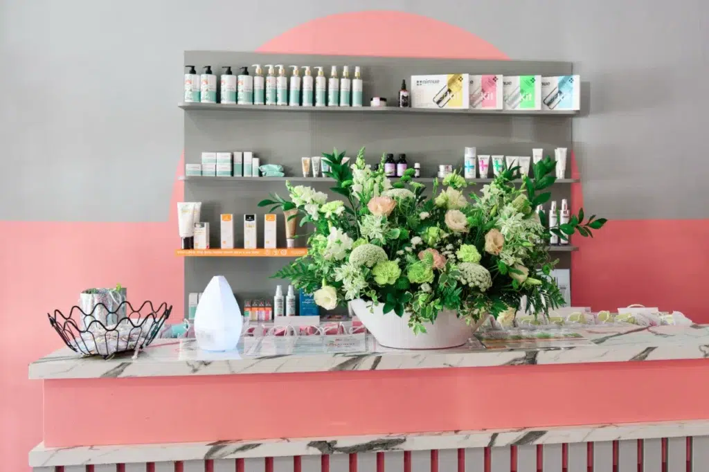 Professional brand photography of Mommy Wellness Claremont's product display, showcasing their premium spa offerings in an elegant setting