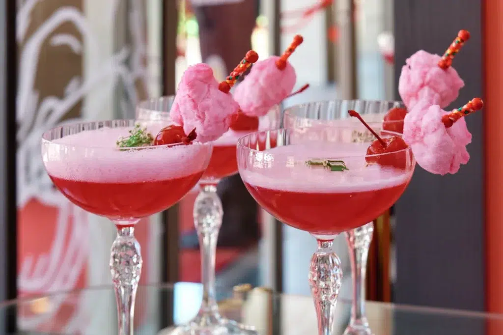 Event photography capturing elegant pink cocktails at Mommy Wellness Claremont's launch celebration by Cape Town corporate photographer