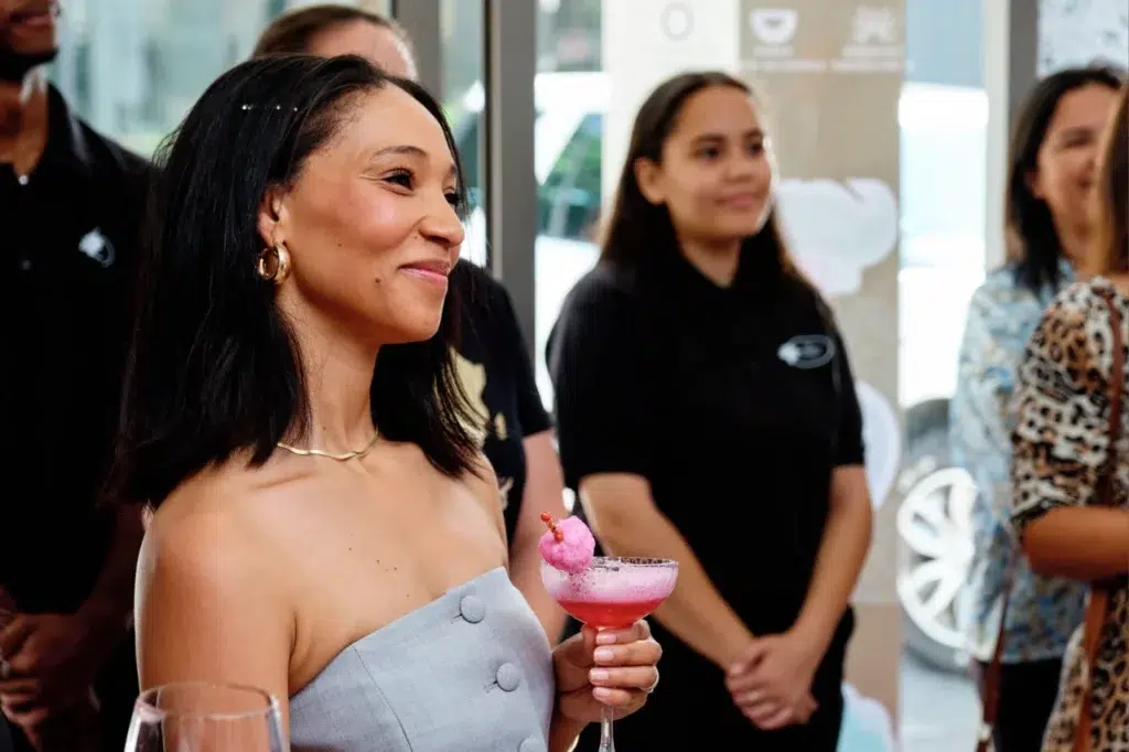 Corporate event photography capturing guests enjoying the grand opening celebration of Mommy Wellness Claremont's new spa location.