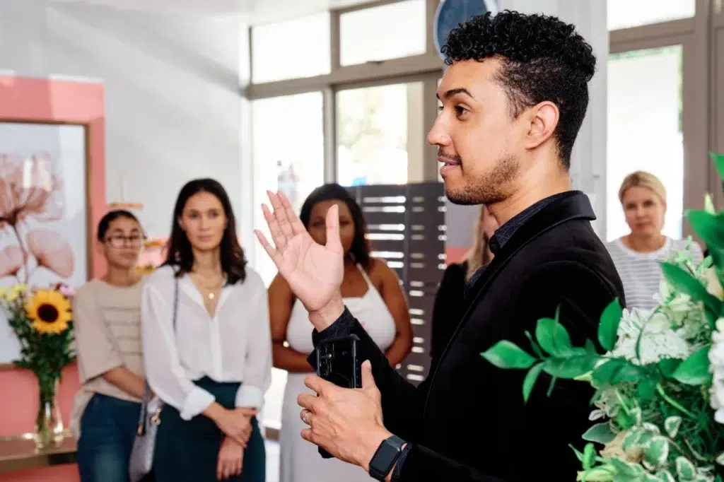 MC Jody Kolbee engaging with guests at Mommy Wellness Claremont launch event