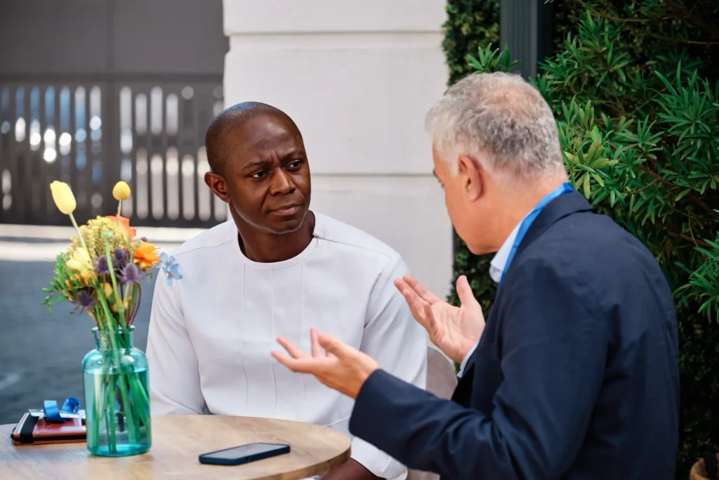 Executives discussing ideas during a corporate conference in Cape Town, photographed by a corporate event photographer at the Argyle, Cape Town